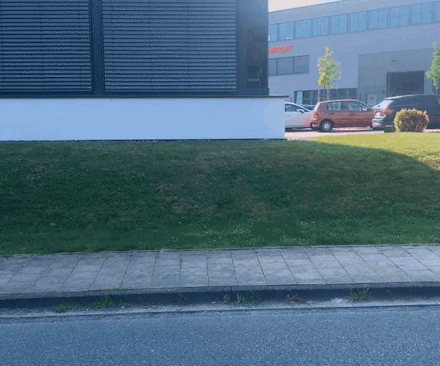 a row of cars are parked in front of a building that says bosch