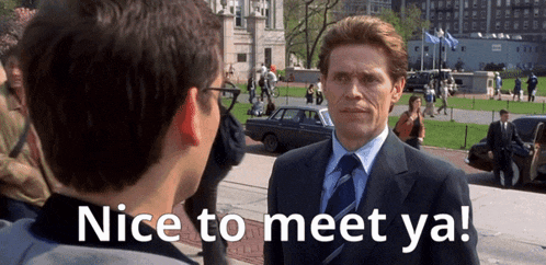 a man in a suit and tie is talking to another man with the words nice to meet ya written below him