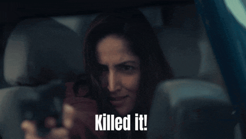 a woman in a car with the words " killed it " on the screen