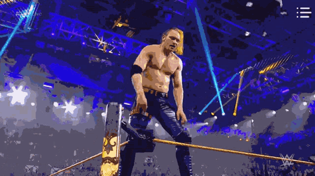 a man in a wrestling ring with the hashtag # 205live on the bottom