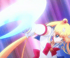 a girl in a sailor moon outfit is holding a blue light in her hand