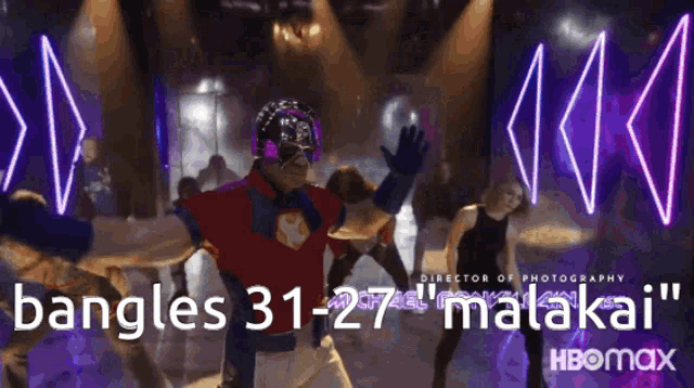 a man in a superhero costume is dancing in front of a neon sign that says ' bangles 31-27 mataka '