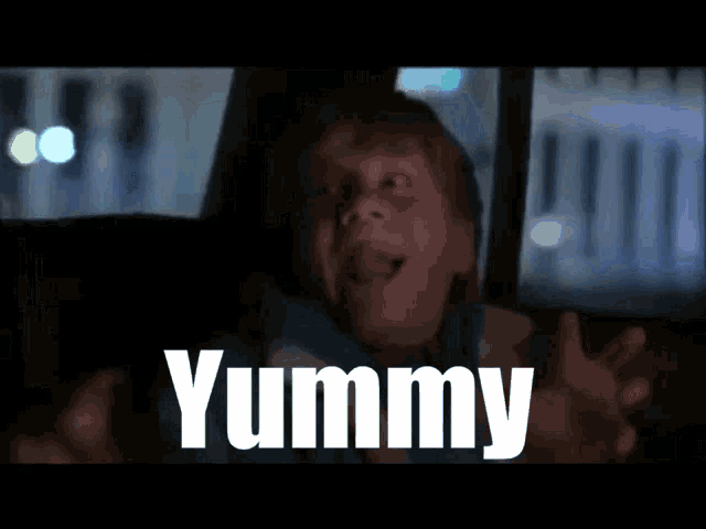 a child in a car with the word yummy written in white