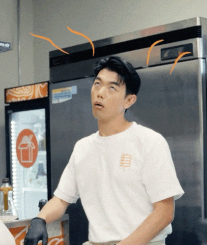 a man wearing a white t-shirt with the word bread on the front