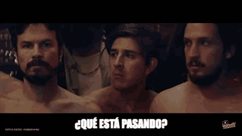 a group of men without shirts are standing next to each other and one of them is asking " qué está pasando ? "