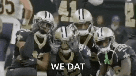 a group of football players are standing next to each other on a field with the words `` we dat '' .
