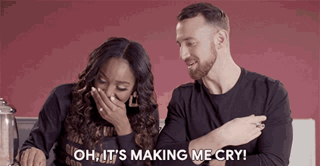 a woman is covering her mouth while a man says oh it 's making me cry ..