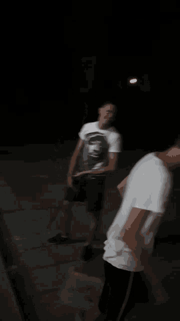 a blurry picture of a man in a t-shirt with a monkey on it