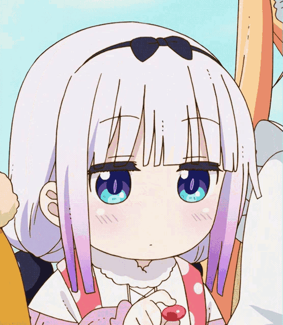 a little girl with white hair and blue eyes