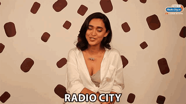 a woman with a plunging neckline and the word radio city on the bottom