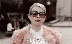 a woman wearing sunglasses and a fur coat is asking for a please .
