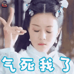 a woman is making a peace sign with her hands