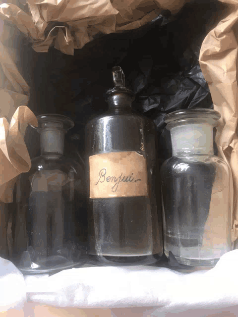 three bottles with one labeled benjui on it