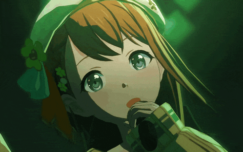a close up of a girl 's face with a green hat on