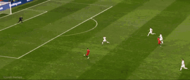 a soccer game is being played on a field with a hotel advertisement