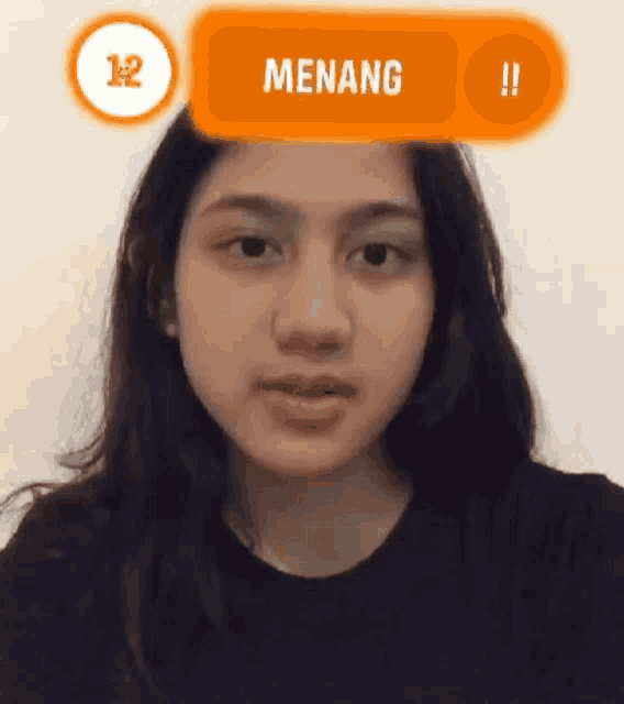 a woman 's face is shown with the word menang above her head