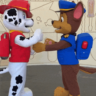 marshall and chase paw patrol mascots shake hands