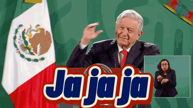 a man in a suit and tie stands in front of a sign that says jaja