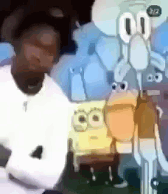 a man is standing next to a cartoon character , spongebob , and squidward .
