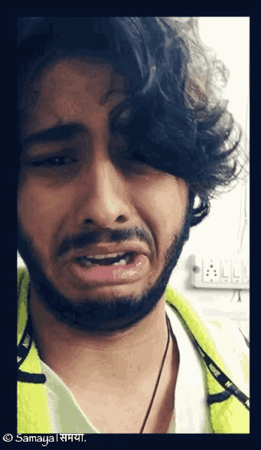 a man with a beard is making a funny face and the name samaya is on the bottom