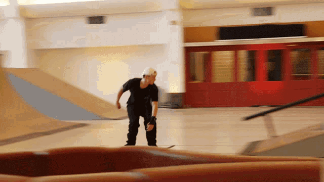 a person riding a skateboard in a skate park