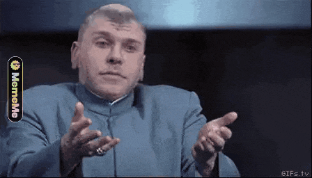 a man in a blue suit is making a funny face while pointing at the camera ..