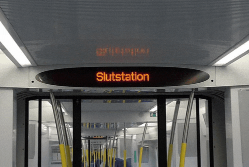 the word slutstation is on a sign above the door
