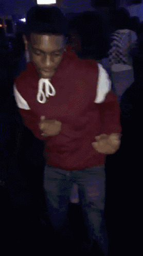 a blurry picture of a man in a red jacket