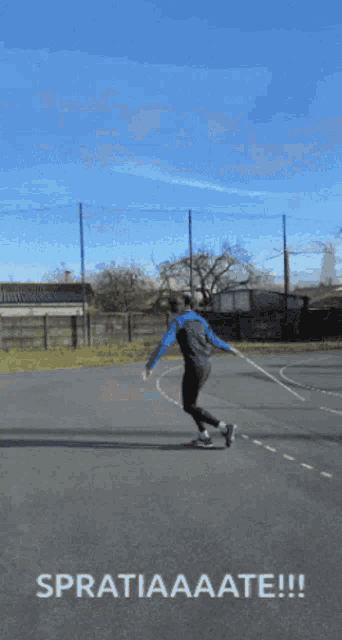 a man is swinging a tennis racket on a tennis court and the caption says spratiaaate