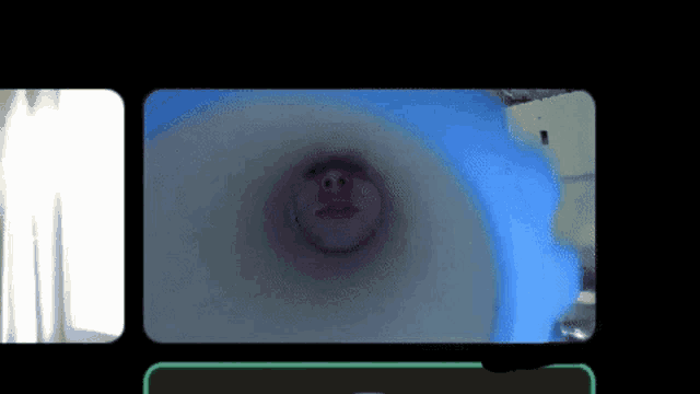 a phone screen shows a picture of a pig with a smiley face on its face