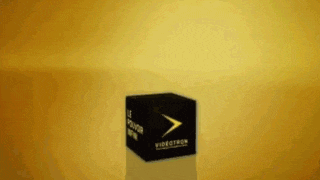 a videotech box is sitting on a yellow surface .
