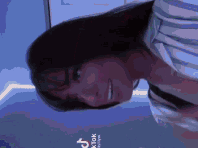 a tiktok video of a person with a hat