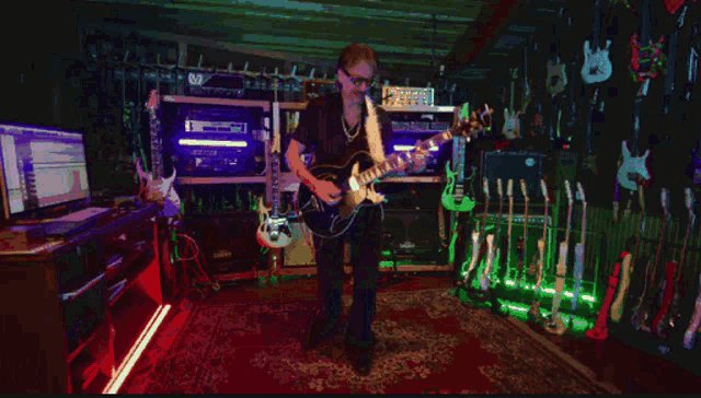 a man is playing a guitar in a room with many guitars