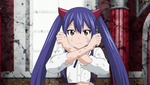 a girl with devil horns is crossing her arms over her chest