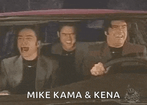 three men are sitting in a car with the words `` mike kama & kena '' written on the side .