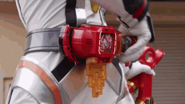 a person is wearing a belt with a red device on it that says ' ii ' on it