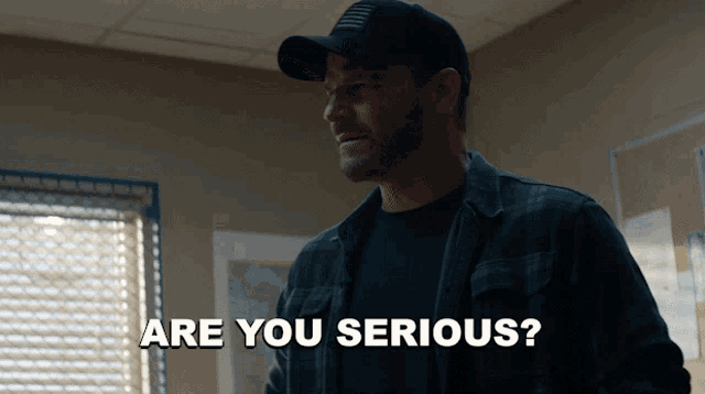a man wearing a hat is asking if he is serious