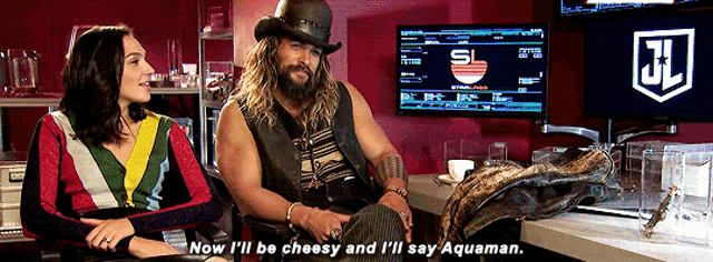 a man in a top hat sits next to a woman and says " now i 'll be cheesy "