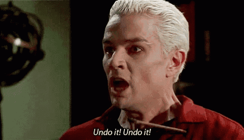a man with blonde hair is holding a stick in his mouth and saying `` undo it ! undo it ! '' .