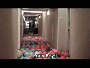 a hallway filled with balls and the words party boy written on the bottom