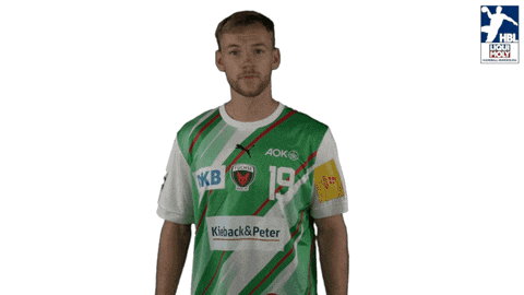 a man wearing a green and white striped shirt with the number 19 on it