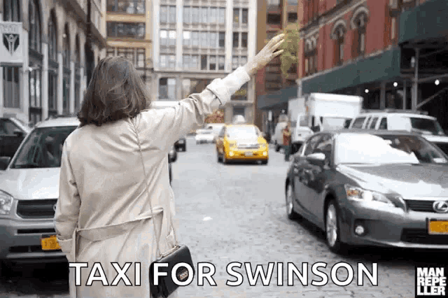 a woman is hailing a taxi for swinson on a busy city street