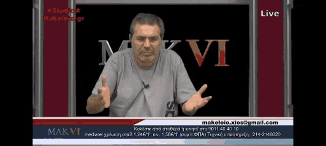 a man in front of a screen that says mkvi