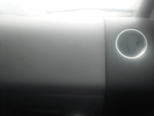 a white circle with a light on it