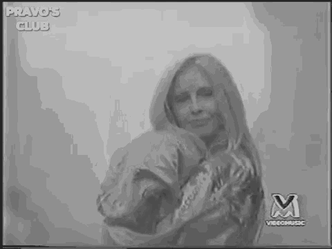 a black and white photo of a person in a video .