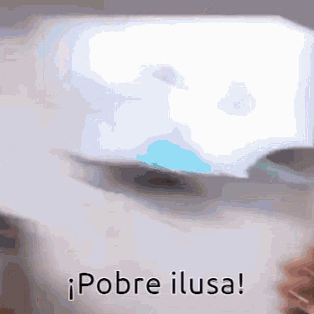 a close up of a person holding a piece of paper that says pobre ilusa