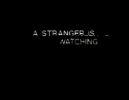 a gray background with the words `` a stranger is watching '' written on it .