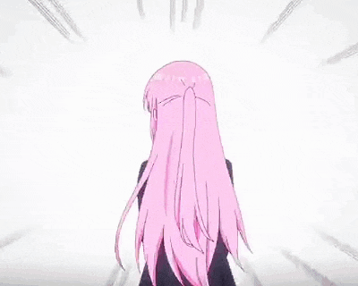 a girl with long pink hair and blue eyes is wearing a black suit and tie .
