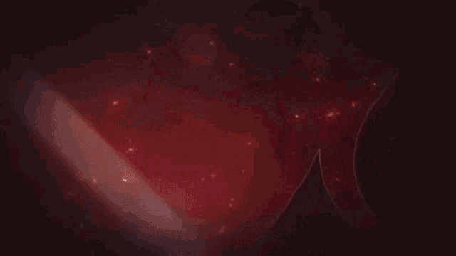 a video game character is holding a spear in front of a red flame .
