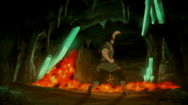 a man in a black coat is holding a torch with a lot of flames coming out of it